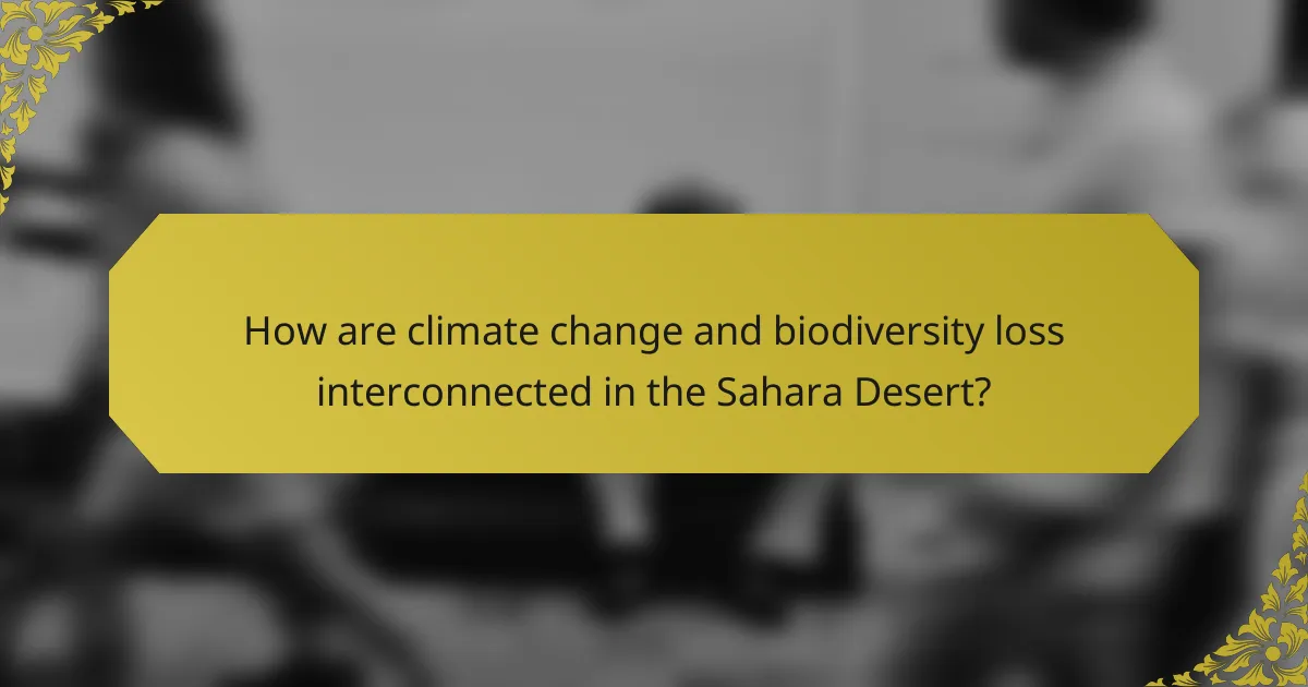 How are climate change and biodiversity loss interconnected in the Sahara Desert?